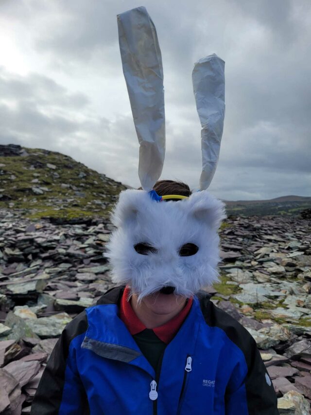 child wearing rabbit mask